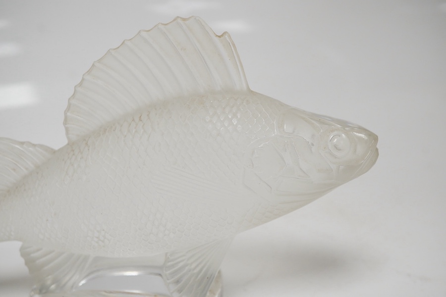 A modern Lalique glass paperweight in the form of a fish, signed to the base, 16cm wide. Condition - good